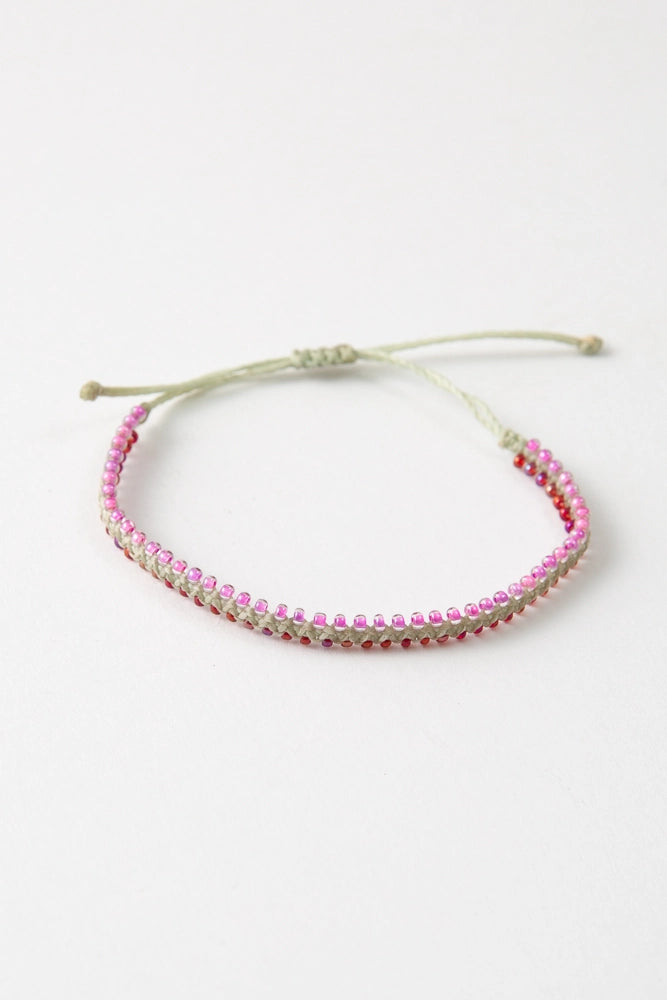 The Bestie colorway features silver thread with pink and red glass bead accents.