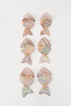 Three pairs of Shellfish Earrings are shown. Due to the natural materials used, the color and markings of the shell vary slightly between pairs.
