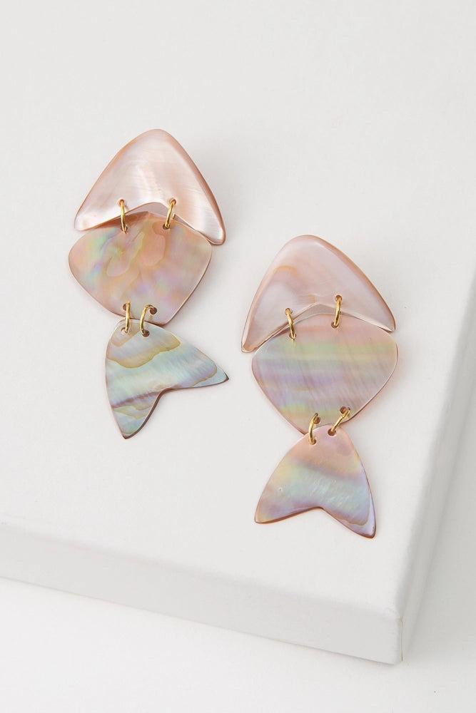 The Shellfish Earrings are composed of iridescent pink shell with natural purple and green striations. Three flat pieces of shell are linked together with gold jump rings to create a fish silhouette that can move freely.