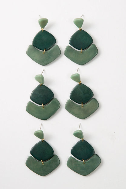 Three pairs of Tortuga Earrings are pictured, showing the natural variations in shade that can occur.